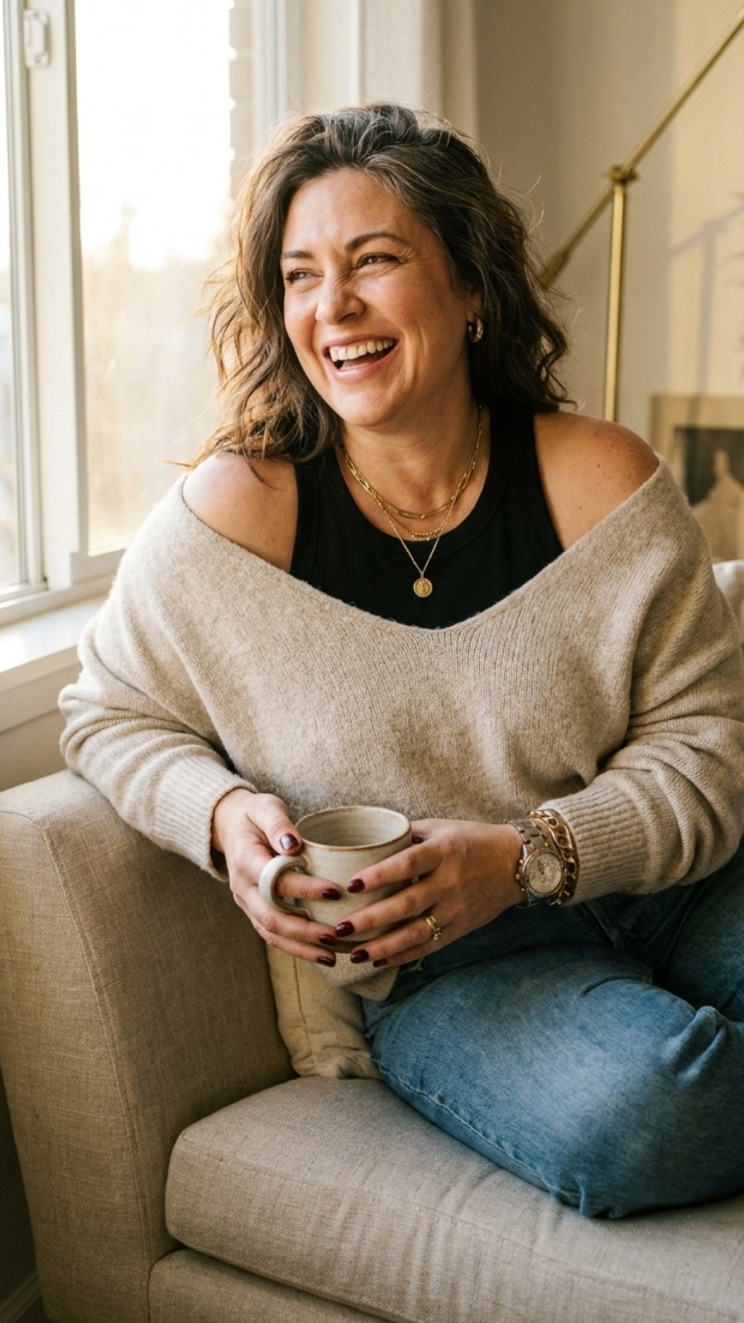 Smiling woman relaxing on a couch