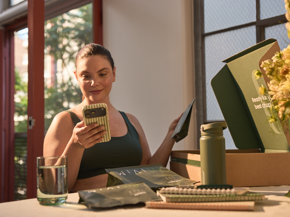 Iv&iacute;m Health patient checking her phone with Iv&iacute;m products
