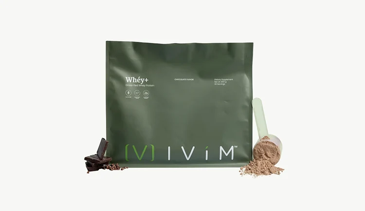 Ivim Whey+ protein pouch with a scoop of powder and chocolate